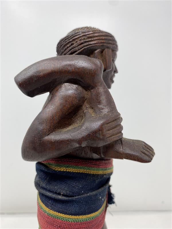 Hand-Carved Wooden Tribal Statue with Traditional Attire
